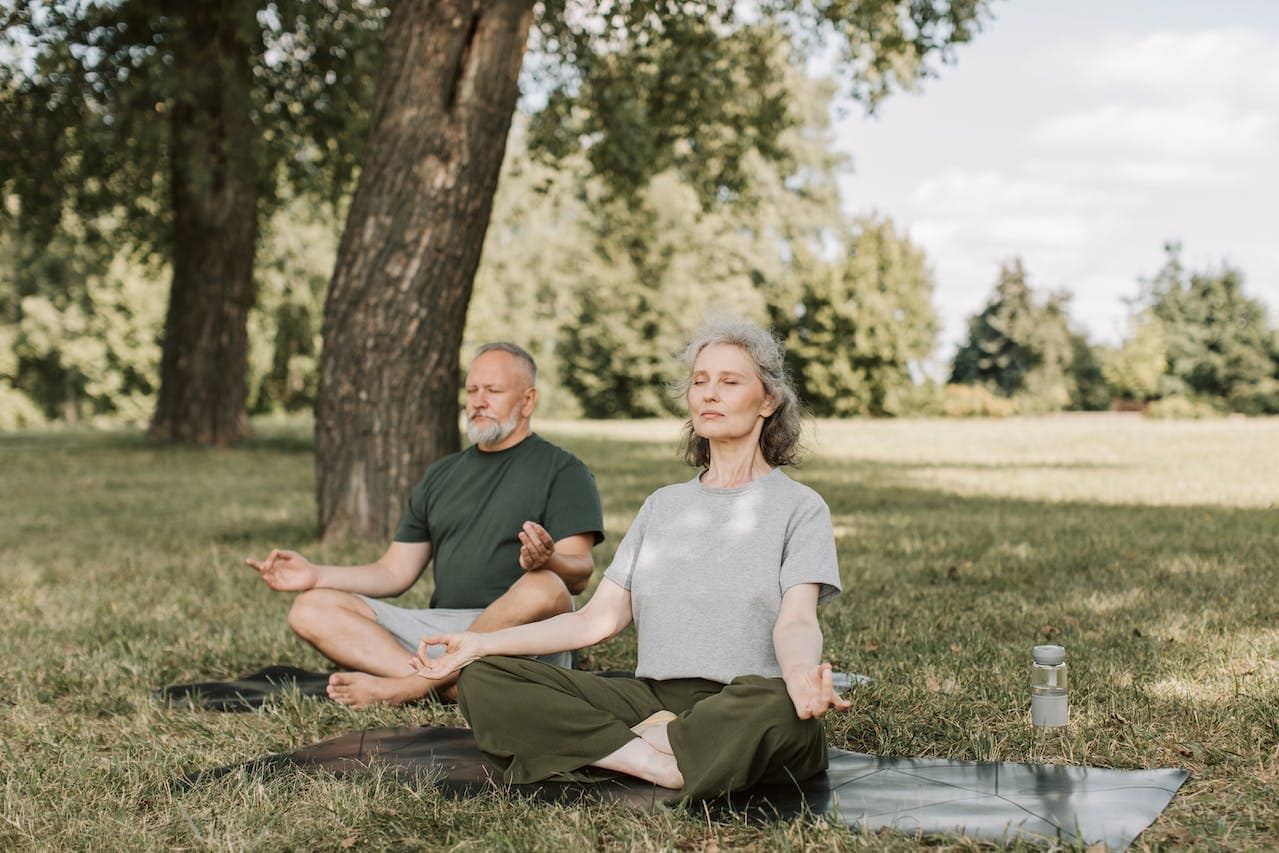 senior couple enjoys yoga