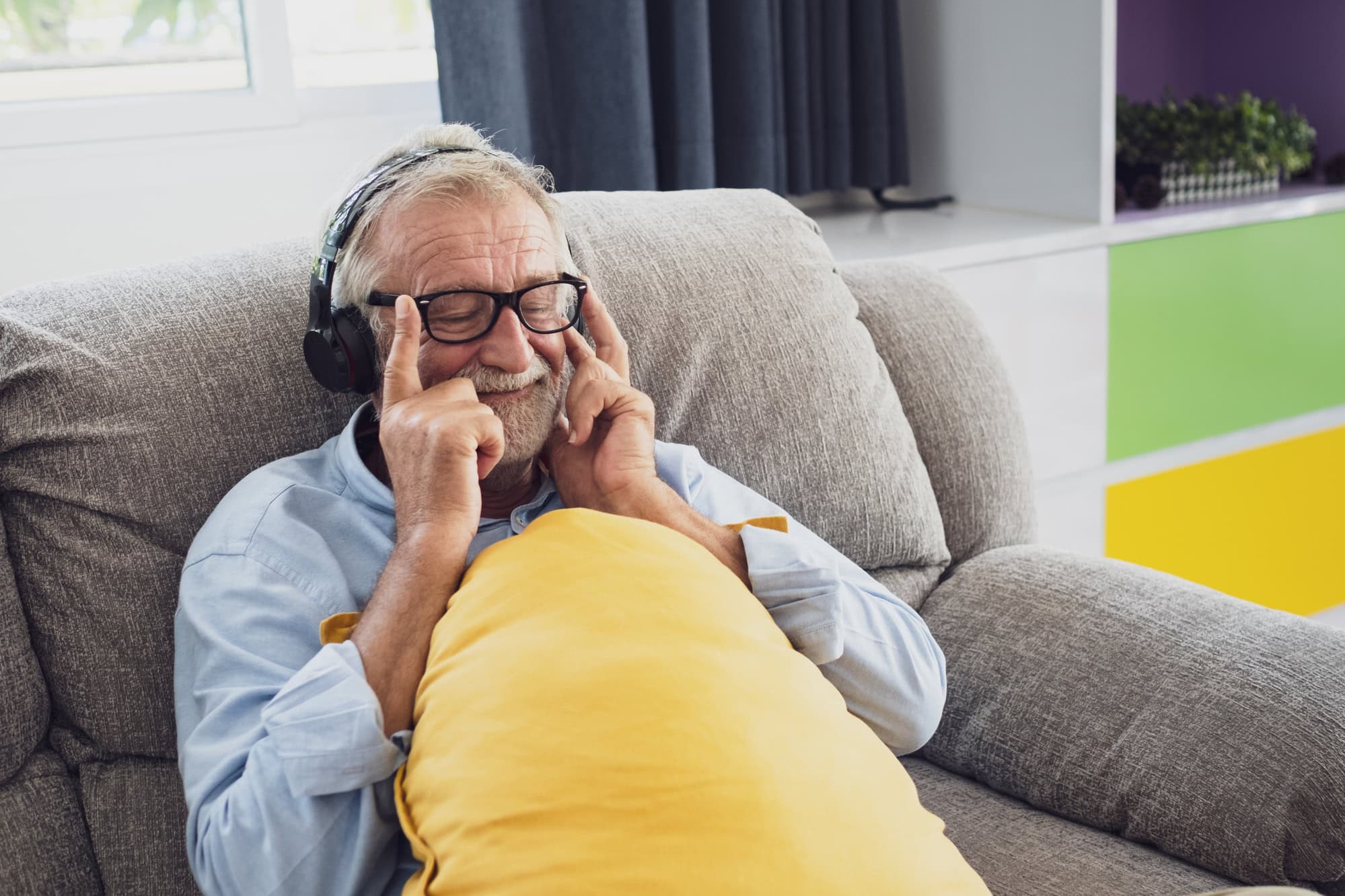 man listening to music as part of memory care